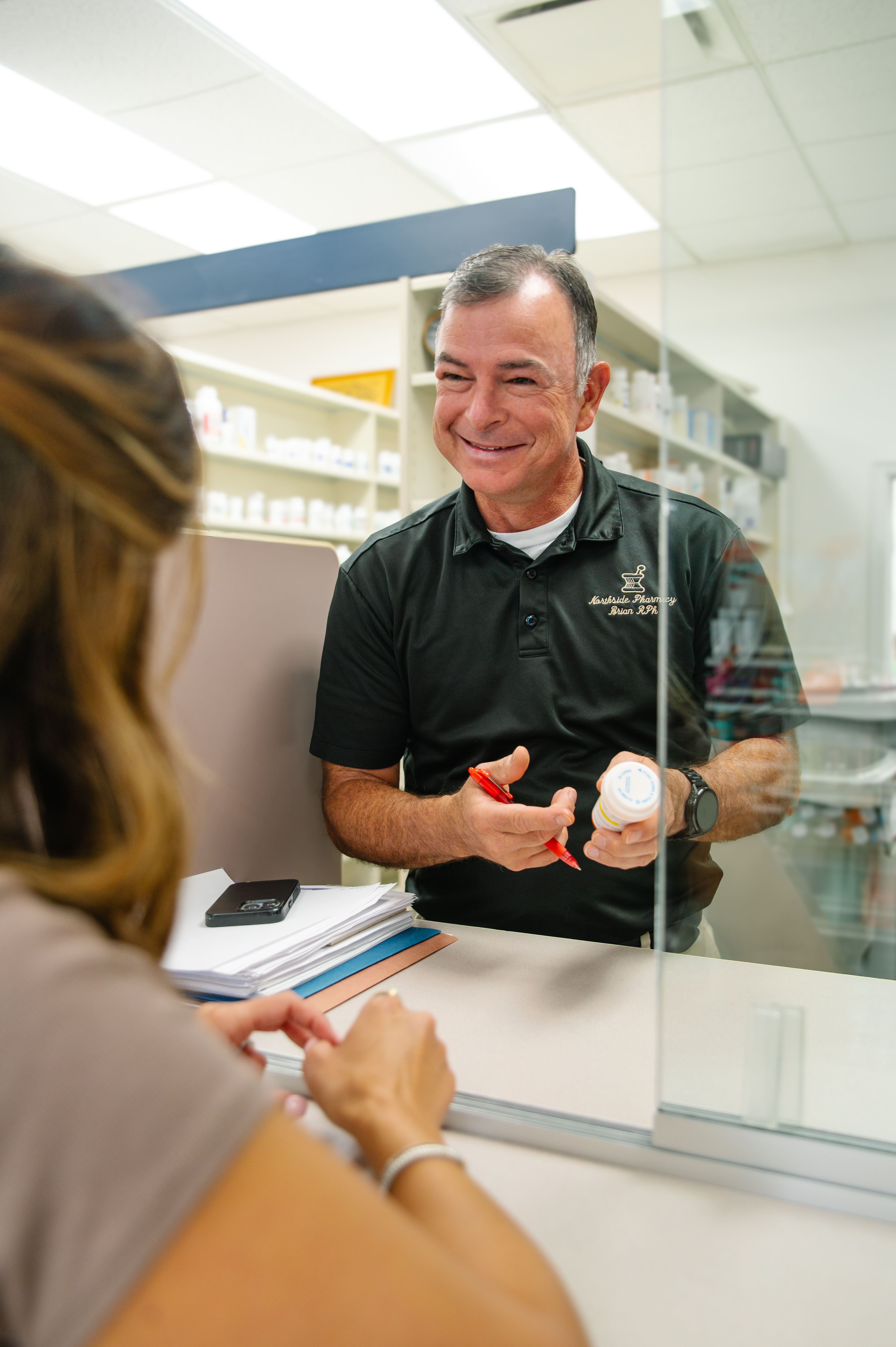 Northside Pharmacy pharmacist helping a patient